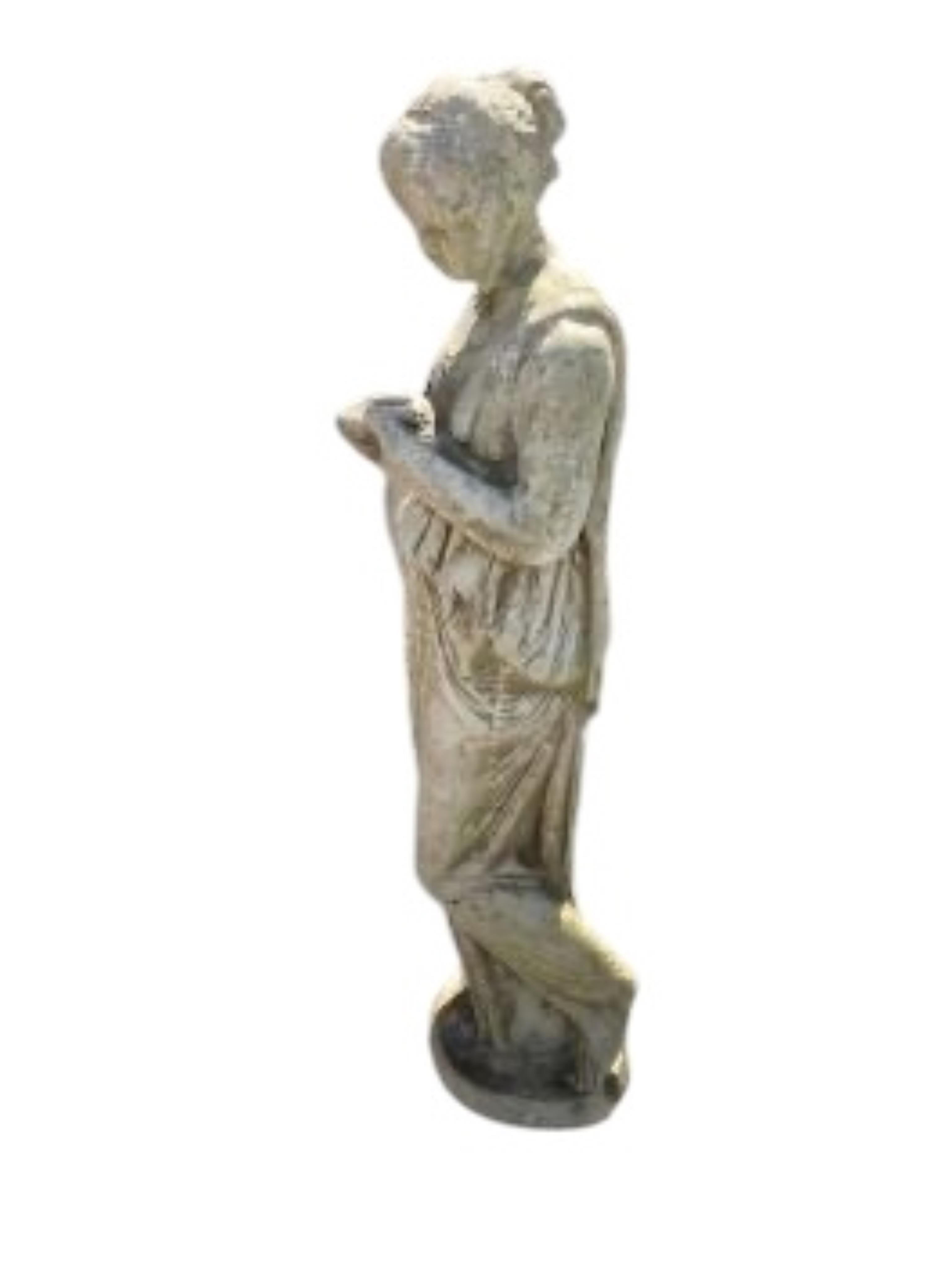 A reconstituted stone female water carrier garden ornament, height 106cm
